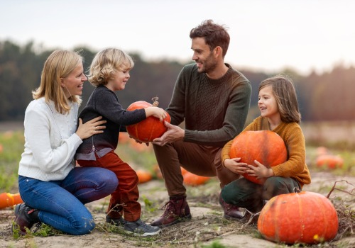 A family picks pumpkins at Tanners Orchard, which offers outdoor activities in East Peoria IL